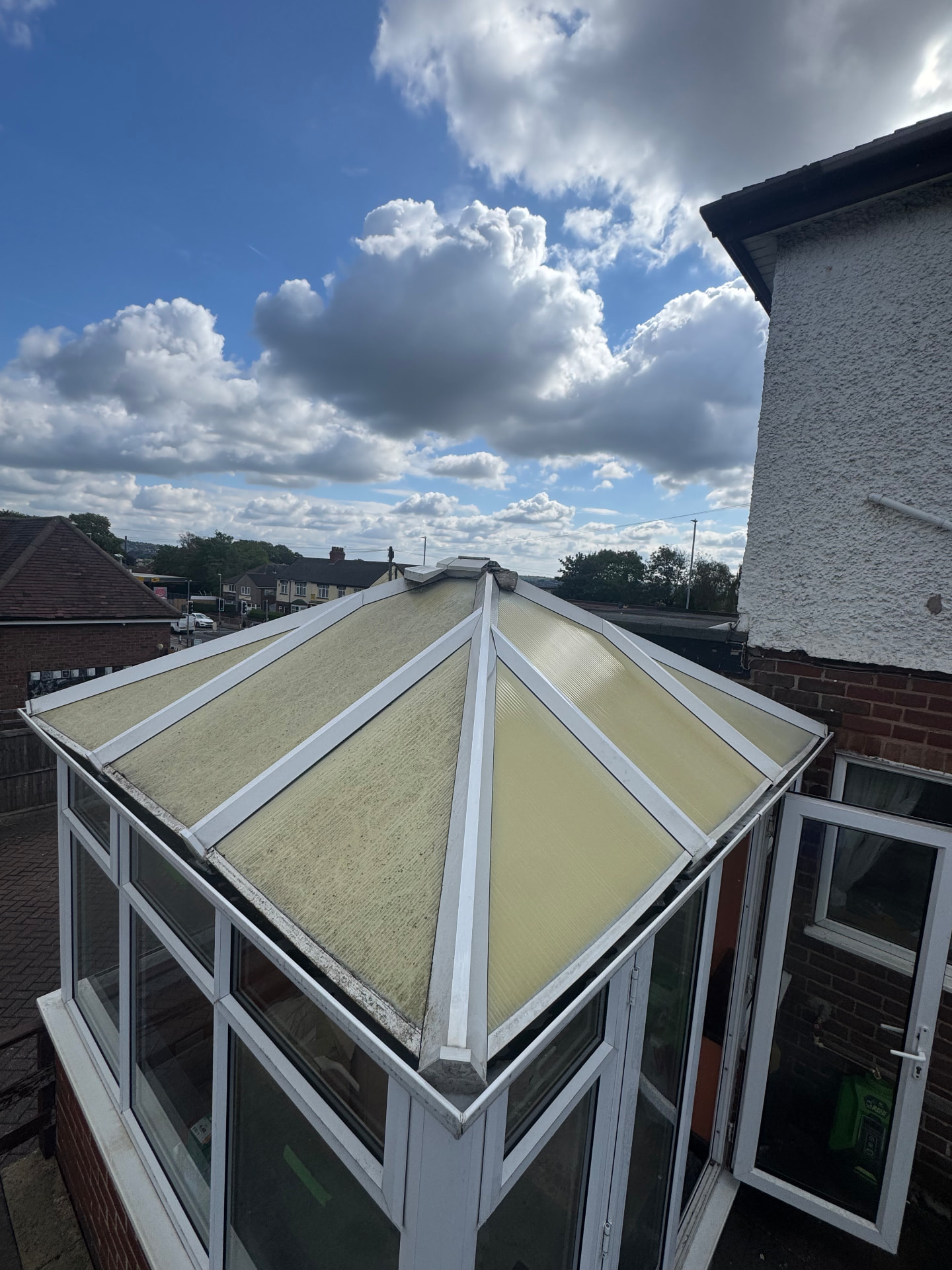 Conservatory roof — moss and algae cleared, panels restored — before cleaning