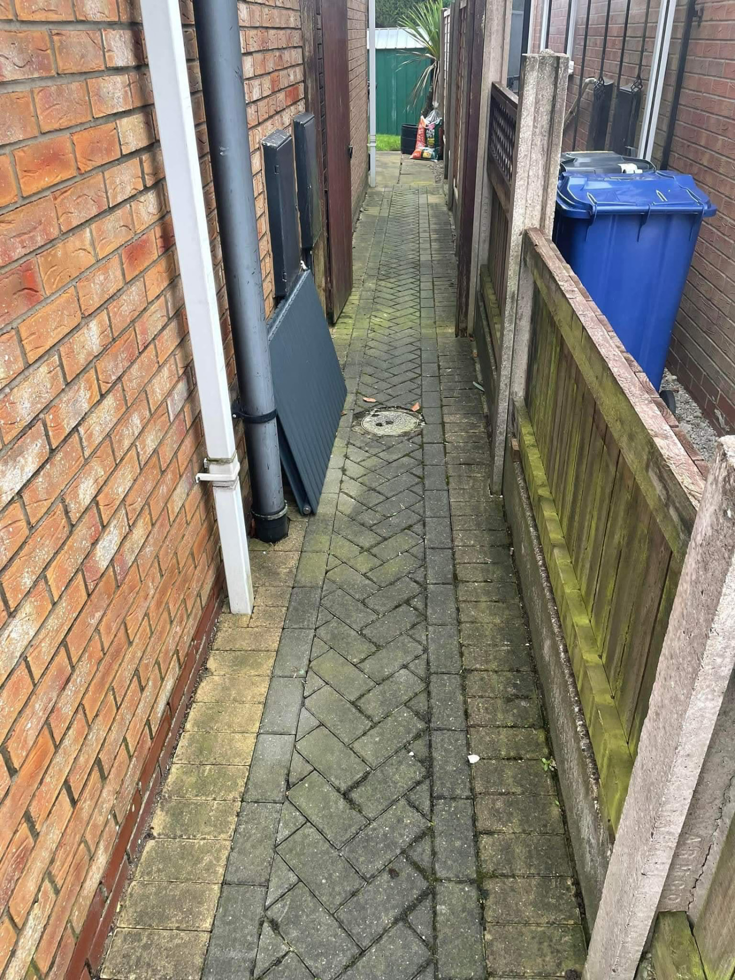 Side path — algae stripped back to the original block colours — before cleaning