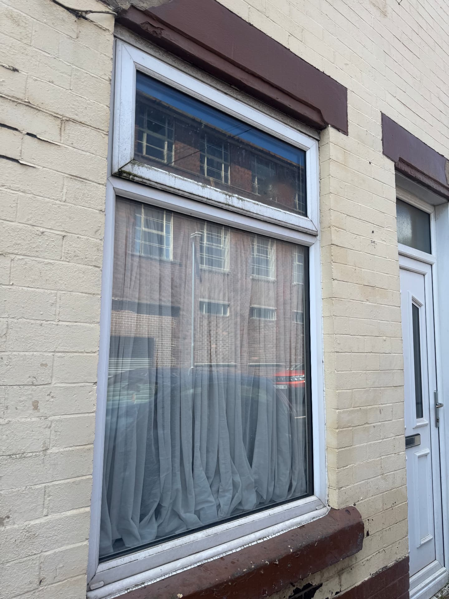 Terraced front window — before cleaning