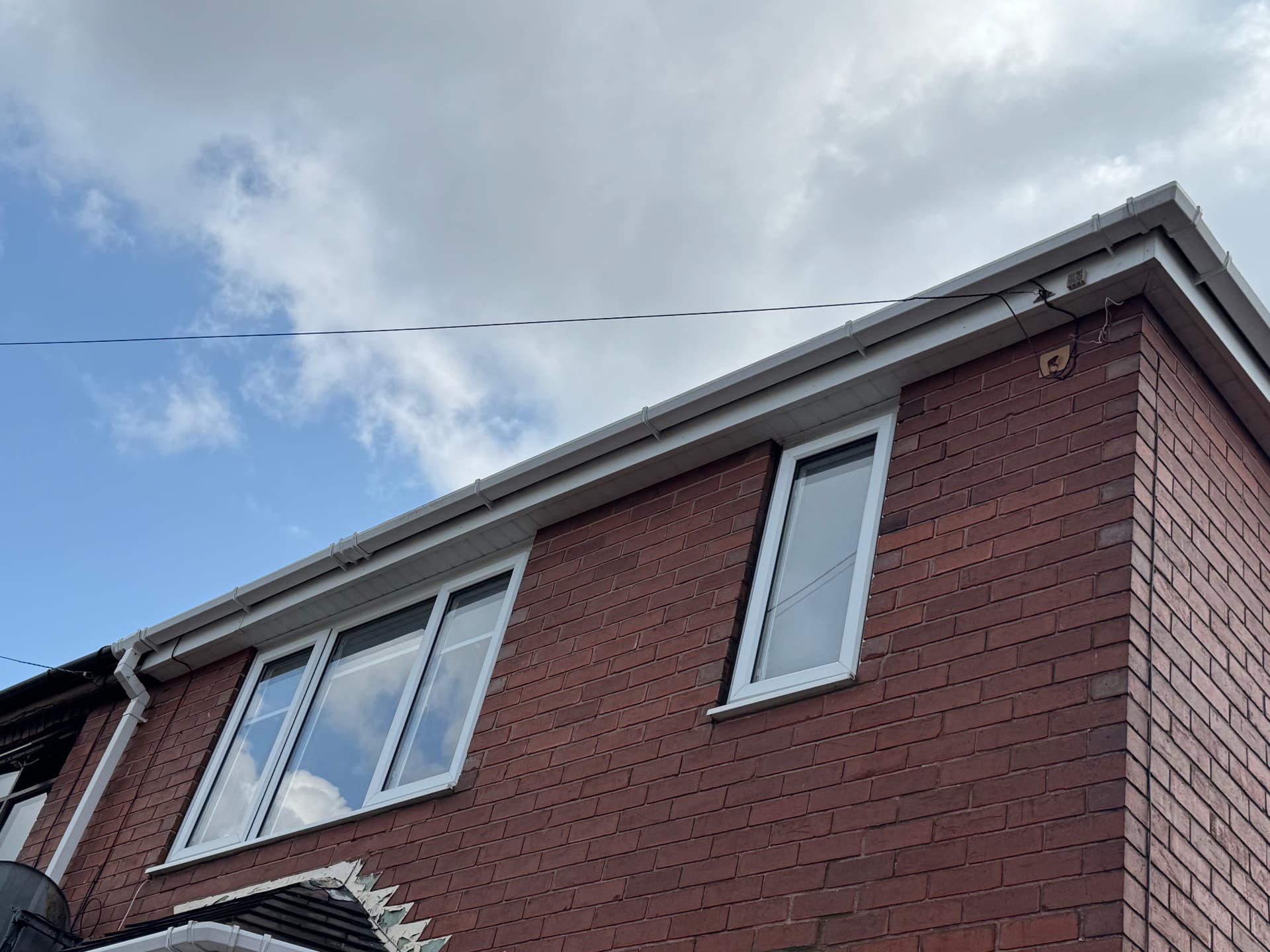 Fascia and gutter line brightened up — after cleaning
